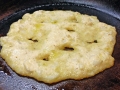 Batter is cooked more and less moist with edges crisp.
